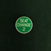 SEAT-CHANGE-2-1.25-GREEN-WITH-WHITE-LETTERING-DOUBLE-SIDED